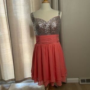 Salmon and silver sequin dress. Size 16. Extendable upper back. Zip up. Ex cond.